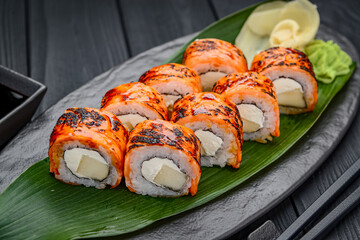 Sushi rolls with grilled salmon and mango.