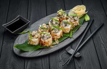 Bonito sushi rolls with scallop, mango and black tobiko caviar.