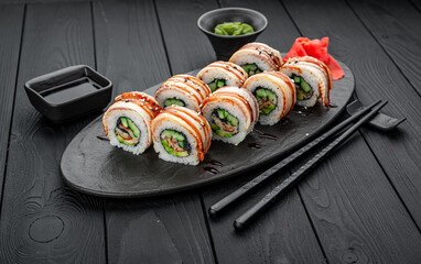 Roll with smoked eel and caviar.