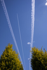 Beautiful blue sky with plane trails. Sunny spring day in Northern Europe.