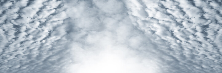 white fluffy clouds in the blue sky . panorama blue sky background with tiny clouds.