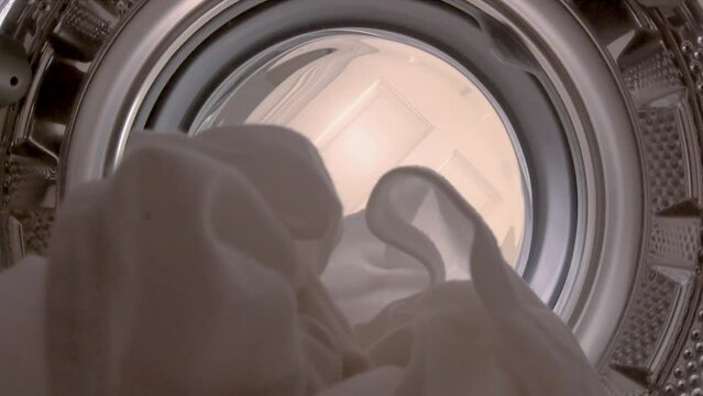 Washing machine is cleaning dirty laundry