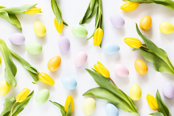 Stylish background with colorful easter eggs isolated on white background with yellow tulip flowers. Flat lay, top view, mockup, overhead, template