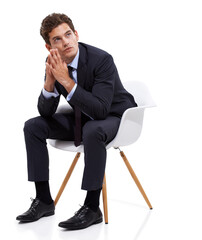 Making a difficult decision. A pensive young businessman sitting on a chair against a white background.