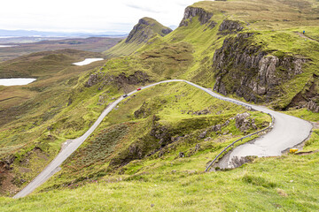 Fototapeta na wymiar The steep road up to the Quiraing Mountain Pass Viewpoint in the north of the Isle of Skye, Highland, Scotland UK.