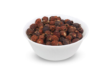 Dried rose hips on an isolated white background. Dried fruits.