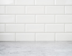 Grey marble countertop against a white brick wall. Kitchen interior, free space for text or object. Blurred background