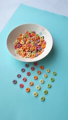 Fototapeta na wymiar cereales de colores fondo celeste blanco