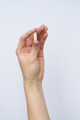 woman hand hold drag or medicine on white background