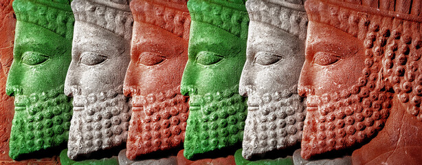  Ancient Persia. Bas-relief carved on the walls of old buildings. Colors of national flag of Iran....