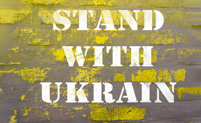 text stand with Ukraine on yellow gray brick wall