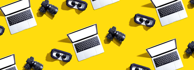 Tech gear theme with vr headset, dslr camera and laptop computer