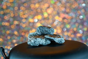 Granites are coarsely crystalline plutonic rocks rich in quartz and feldspar, but also contain dark...