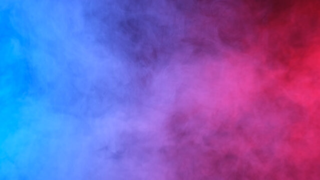 Red, blue, purple smoke on black background