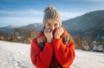 Fototapeta na wymiar Happy winter time cheerful woman having fun outdoor