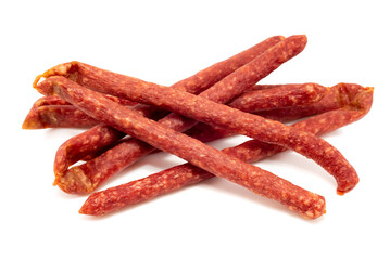 Dry sausage on a white background. Thin smoked sausages isolated