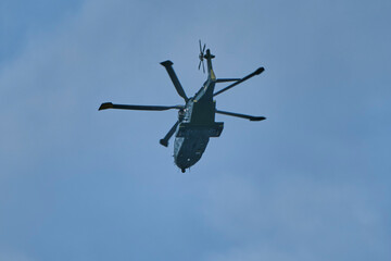 Flying helicopter.