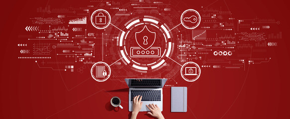 Cyber security theme with person working with a laptop