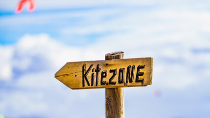 Kitezone sign at beach.