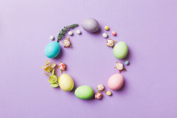 round frame Multi colors Easter eggs on colored background . Pastel color Easter eggs holiday concept with empty space for you design