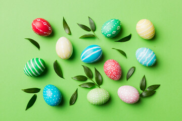 Colorful Easter eggs with spring flower leaf isolated over white background. Colored Egg Holiday border