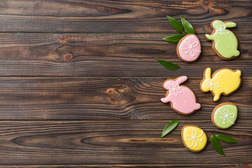 holiday preparation Multi colors Easter eggs with cookies on colored background . Pastel color Easter eggs. holiday concept with copy space