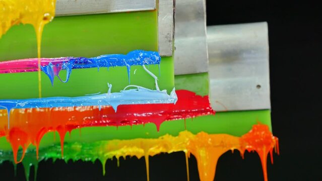 colorful plastisol ink in transparent bottles in screen printing