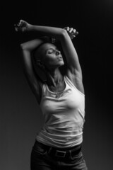 emotional studio portrait of a young attractive bald girl black and white image