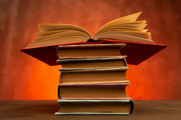 Wisdom and education concept.Book on the table, love reading. Retro neon light 90s