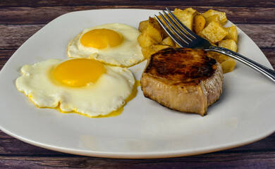 fried eggs with steak  and home fries