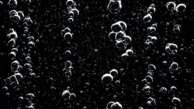 Underwater air bubbles or a carbonated beverage floating upwards on black background with luma matte