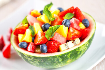 Fresh fruit salad with strawberries, blueberries watermelon and peaches