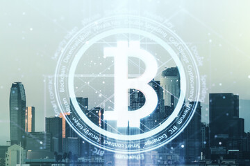 Double exposure of creative Bitcoin symbol hologram on Los Angeles city skyscrapers background. Cryptocurrency concept