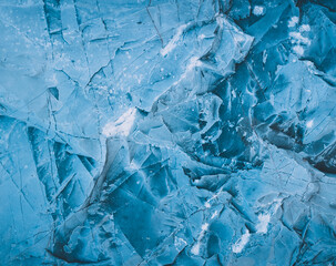 Cool background. Splits in ice. Ice cracks. Rock texture. Ice texture. Rough structure mineral. Stone background. Ice surface texture. Abstract texture. Lava frozen. Rock pile.