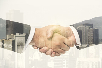 Multi exposure of handshake two businessmen on cityscape background, deal and partnership concept