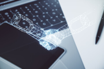 Creative concept of blockchain technology with handshake on modern laptop background. digital money...