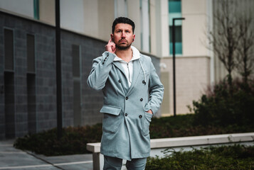 Businessman with mobile phone and bluetooth headset.