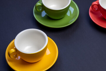 Beautiful color cups on a dark background