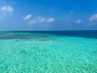 Maldives tropical beach sea with blue sky background