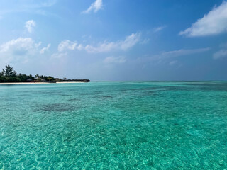 Maldives tropical beach sea with blue sky background