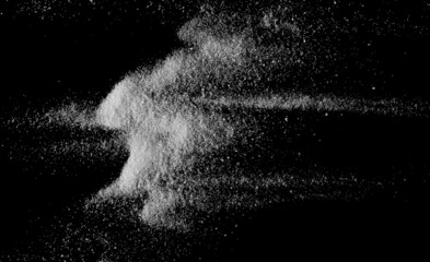 Sea salt crystals isolated on black, top view 