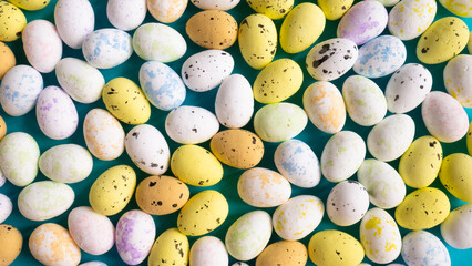 Colorful Easter eggs background - quail eggs.
