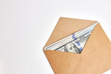 Dollar bills in a brown envelope. Bribe offer.