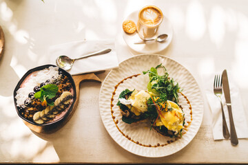 Top view of delicious morning food for keeping healthy lifestyle with fruits and granola on breakfast, overhead picture of plates with tasty food homemade prepared with fresh organic ingredients