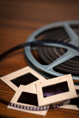 Shallow focus background image of 35mm slides and 8mm Super 8 film reel with vintage filter - 491496696