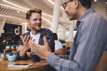 Multiracial business men working in office space