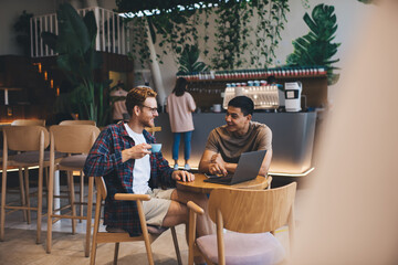 Multiracial business men working in office space
