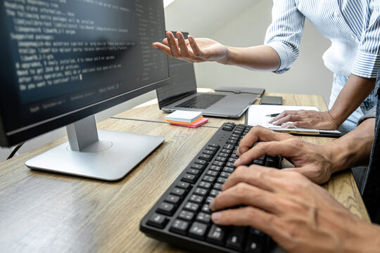Programmer Team of  Developing programming and website working in a software develop company office, writing codes and typing data code, Programming with HTML, PHP and javascript
