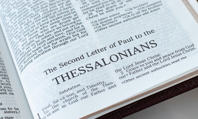 Thessalonians open Holy Bible Book close-up. New Testament Scripture. Studying the Word of God...