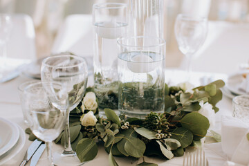 Decorations on the wedding table for a festive dinner in a restaurant